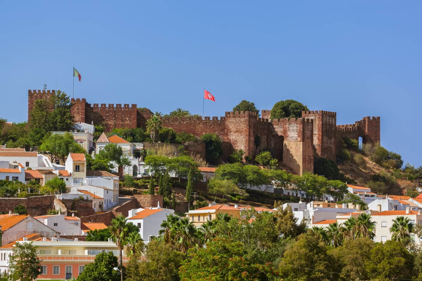 Silves Castle with its red sandstone walls overlooking the whitewashed town below
